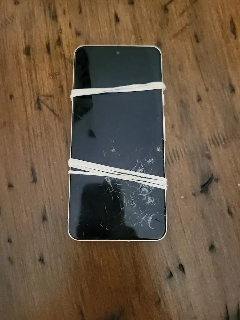 Cracked iPhone screen example (spiderweb cracks)