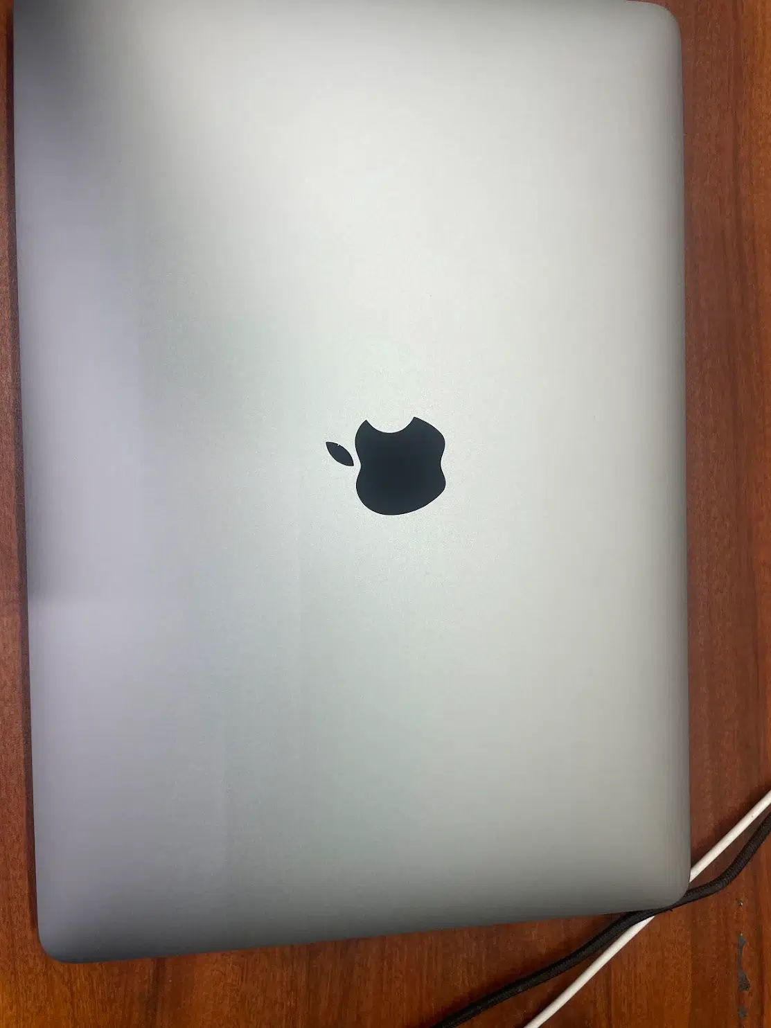 Closed silver MacBook Pro at Phone Repair & More